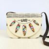 handmade wooden bag with stylized leaf motif