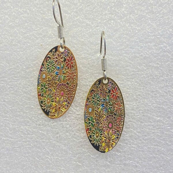 single earrings for women with oval shape and golden flower field pattern