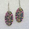 single earrings for women with oval shape and pink heart swirls pattern
