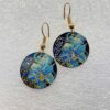 single earrings for women with round shape and blue flower swirl pattern