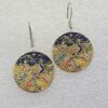 single earrings for women with round shape and golden peacock garden pattern
