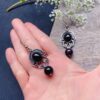 stone earrings for women with black filigree oval pattern 2